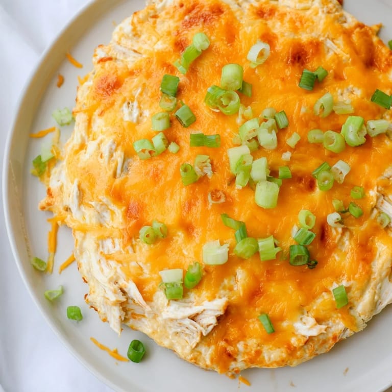 Delicious and cheesy baked Buffalo Chicken Dip brimming with hot sauce and tender chicken.