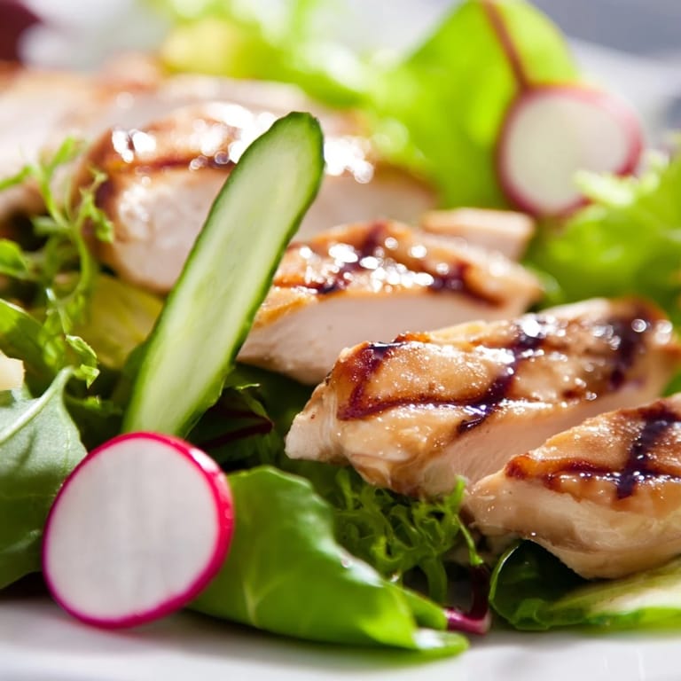 A nutritious Spring Detox Chicken Salad features juicy grilled chicken, mixed greens, crisp cucumber, and radish slices, all tossed in a bright lemon vinaigrette.