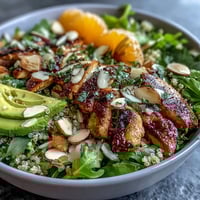 Juicy Citrus Herb Chicken Salad Bowl, bright with avocado and fresh oranges, ready to eat.