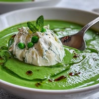 Vibrant spring pea soup with creamy ricotta and fresh mint oil.